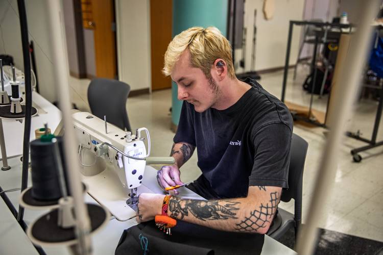 A student hard at work on an avian biomimicry fashion project.