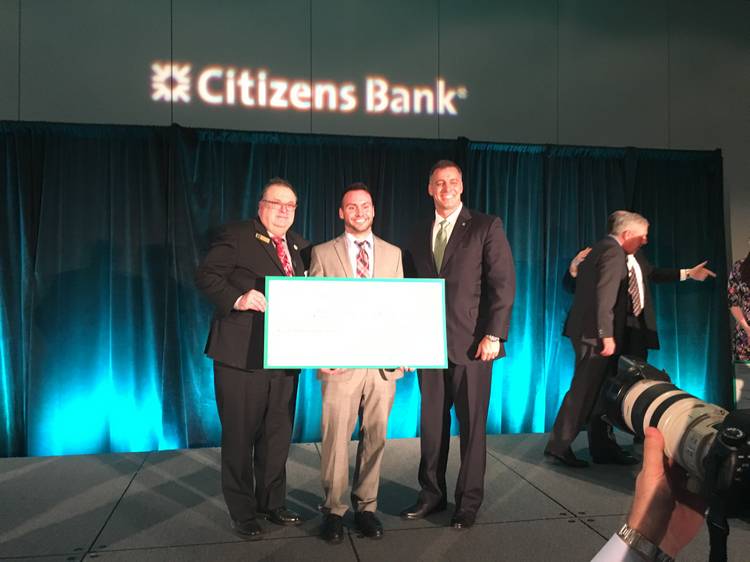 Ben Colas accepts the check in 2016 for his winning concept, Kinderkits.