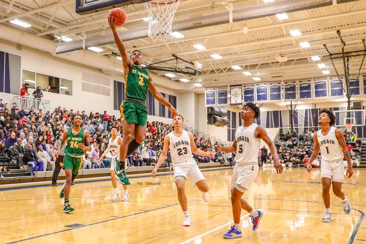 Montorie Foster Jr. ’20 of St. Edward High School takes it to the hoop in a game against Lorain High School..