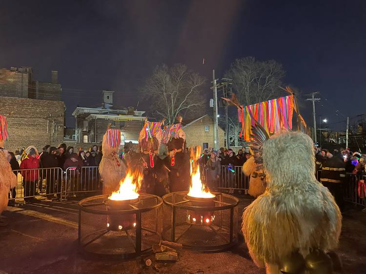 The Kurenti awake and arrive at the bonfire to chase away winter and usher in spring.