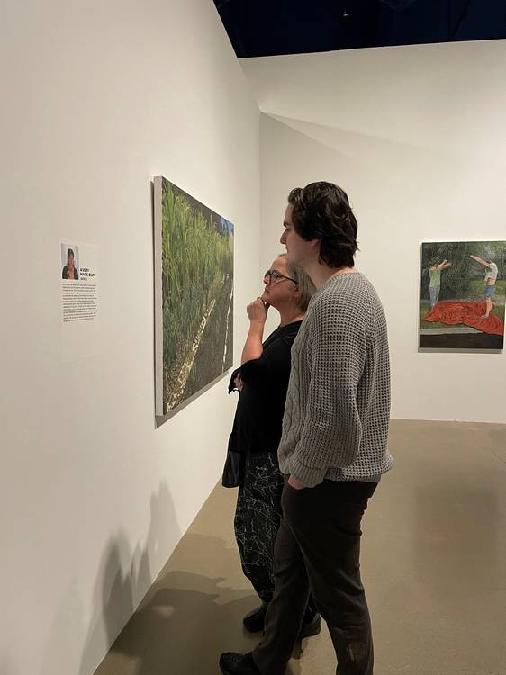 Visitors study the work of Akron artist Avery Mags Duff at at moCa Cleveland's 2026 season opening event.
