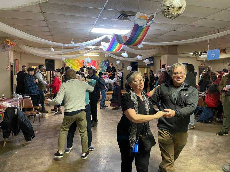 Festival goers dance to the tunes of Fešta Bend in the Slovenian National Home main hall.