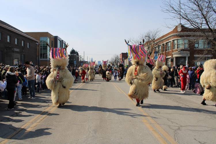 The 2026 Kurentovanje parade down St. Clair Avenue against the Cleveland skyline.