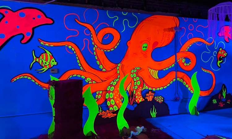 Local artists created AFTERGLO black light installation, to  Waterloo Arts into a psychedelic experience.