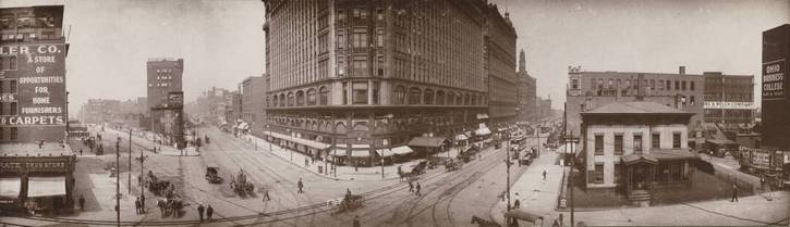 Development began in the area shortly after the Rose Building was completed in 1906. The Schofield Building, completed in 1902, stands immediately to its right.