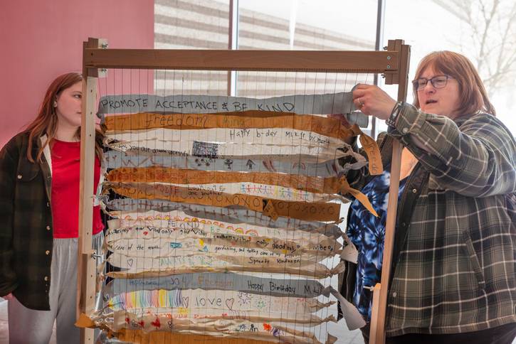 Remember Love Recovery Project making a mini flag to depict our history of protest, care for one another. and contemporary issues.