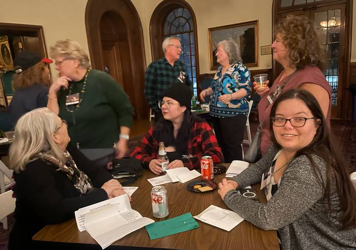 Discussing possible motives and socializing.