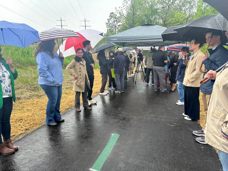 The wet weather did not deter people from coming to the Metroparks West Creek Reservation in Parma for the West Creek Greenway trail ribbon cutting.