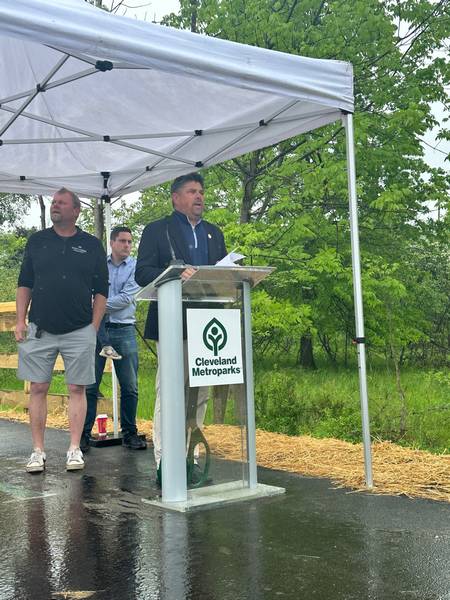 Cleveland Metroparks CEO Brian Zimmerman speaks during the West Creek Greenway trail opening ceremony at West Creek Reservation in Parma on May 20.