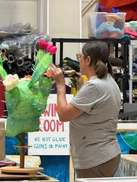 Volunteers put the finishing touches on the Parade the Circle art projects.