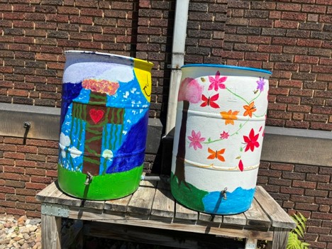 Left, the two deaf 8th graders who designed the willow barrel combine faith and the environment. Right, two 7th graders painted flowers and butterflies.