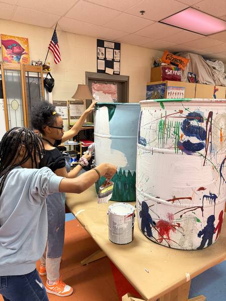 Wilsson School students work on their rain barrels.