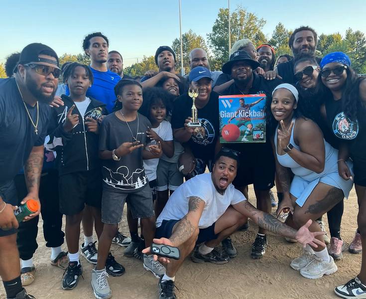 A kickball team celebrating after the game at One South Euclid's Recess Rewind.