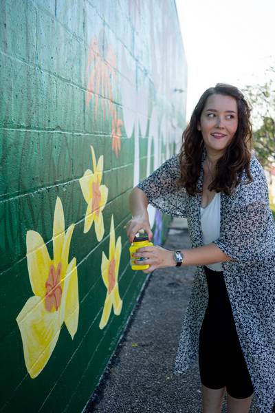 Painting flowers on 'Grow Together.'