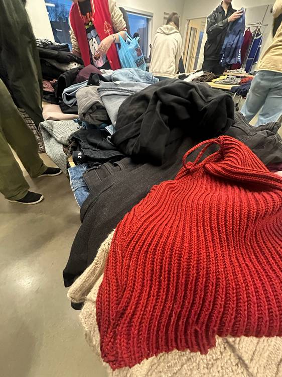 The free community clothing exchange celebrates queer style, self-expression, and sustainability!