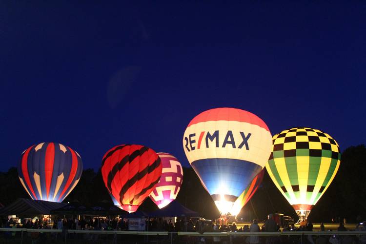 Hot air balloons at night at Blossom Time 2025 in Chagrin Falls.