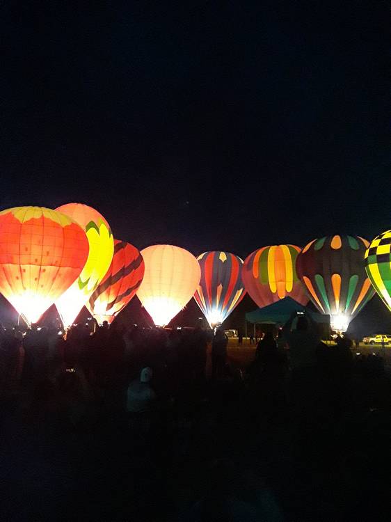 The hot air balloons glow in the night at Blossom Time 2025 in Chagrin Falls.