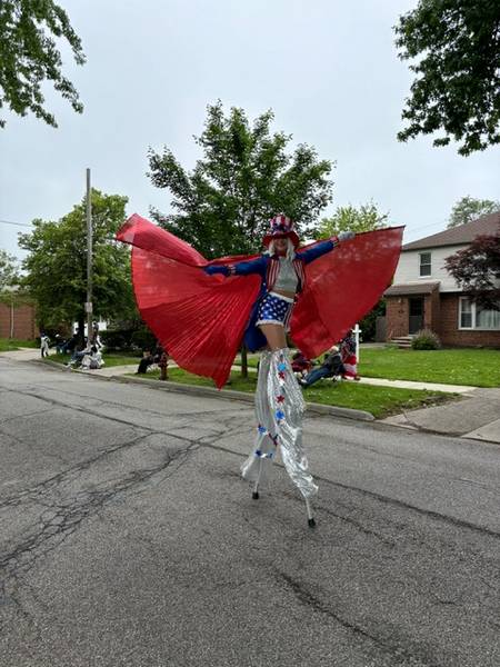 A costumed stilt walker.