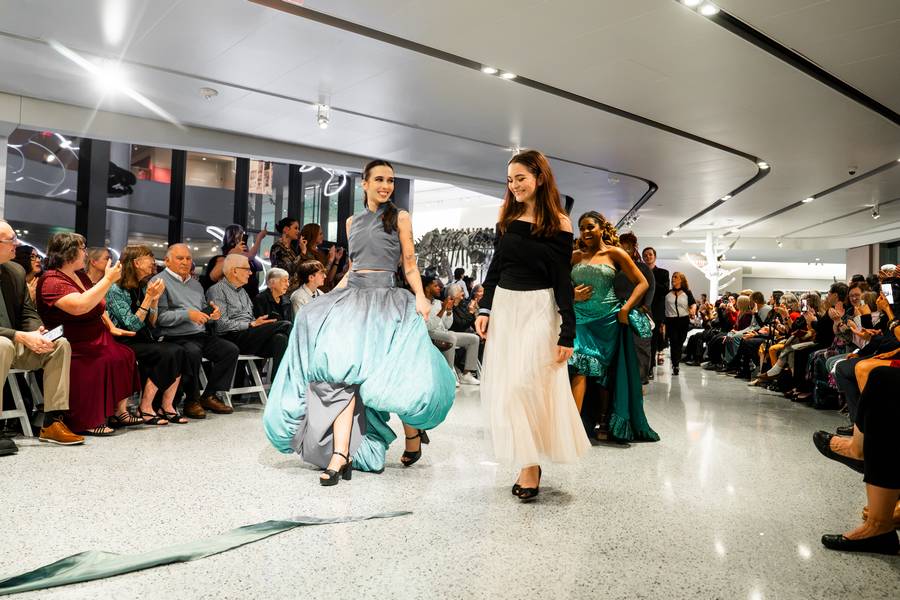 Models wear feather-inspired designs for 'Fashion & Feather,' a collaboration between the Cleveland Museum of Natural History and Kent State University.