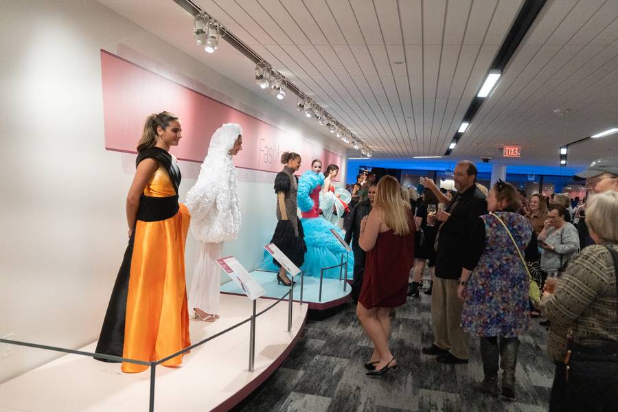 Models wear feather-inspired designs for 'Fashion & Feather,' a collaboration between the Cleveland Museum of Natural History and Kent State University.