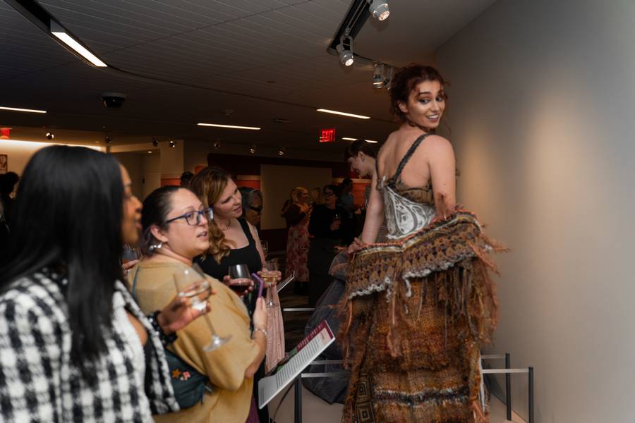 Models wear feather-inspired designs for 'Fashion & Feather,' a collaboration between the Cleveland Museum of Natural History and Kent State University.