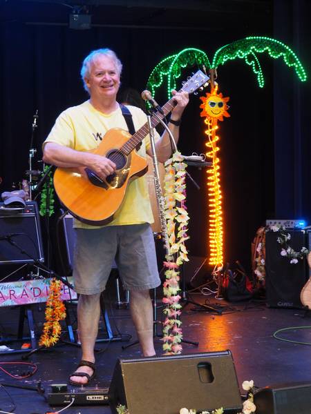 Tom Todd strumming and singing the Parrothead tunes for Cheesburgers in Paradise.