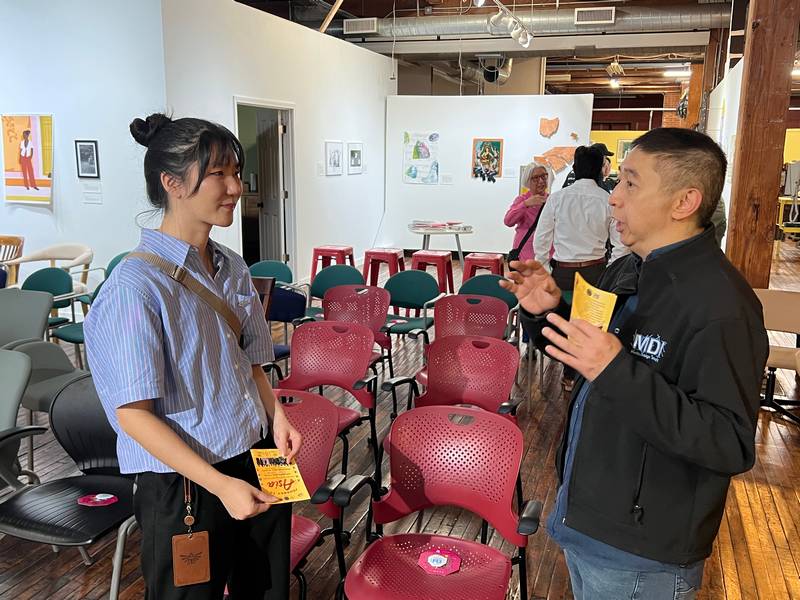 Cleveland Institute of Art ptofessor Margaret Li chats with filmmaker Johnny Wu at the Northeast Ohio Asian American Arts launch party.