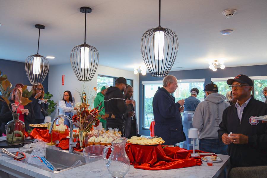 Guests mingle and enjoy refreshments at the Nobility Court ribbon cutting ceremony.