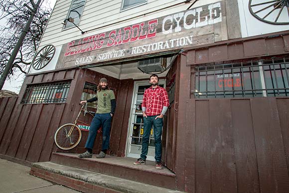 Travis Peebles and James Rychak, co-owners of Blazing Saddle Cycle west side location