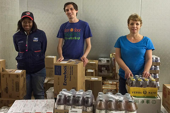 John, Carrie and Monet of Door to Door Organics - Ohio hard at work preparing deliveries