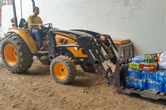 Matt prepping for 120 college interns at a Group Volunteer Day on the Cub Cadet tractor
