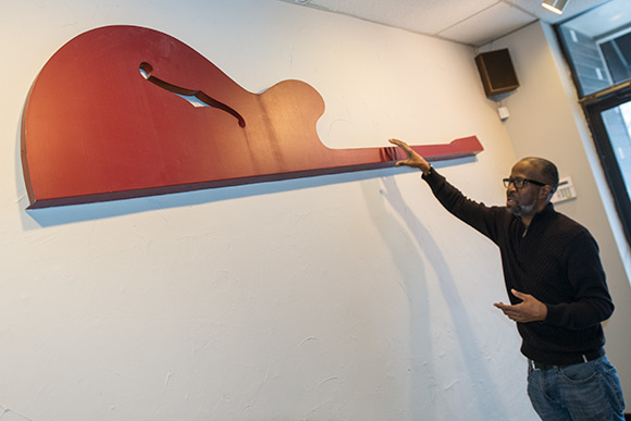Part of the original sign from Heights Guitars hangs proudly in the new Heights Music Shop