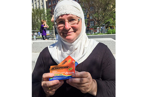 Julia Shearson of CAIR-Cleveland offering passers by 'Islamophobin,' to treat intolerance