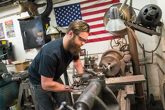 Alex uses equiptment from the 1900's to hand tool some of his parts