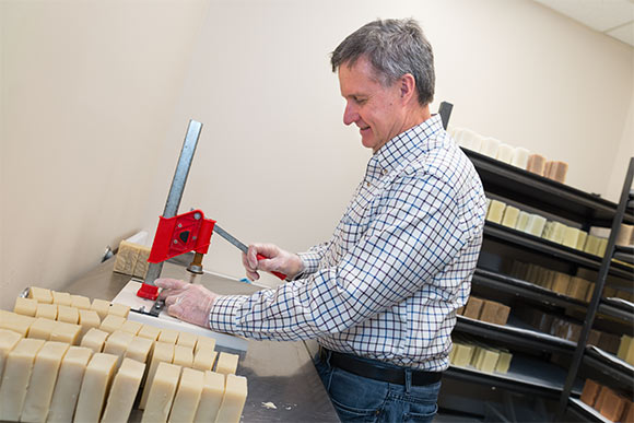 Owner Bill Brink of Pure Enchantment logo stamping soap