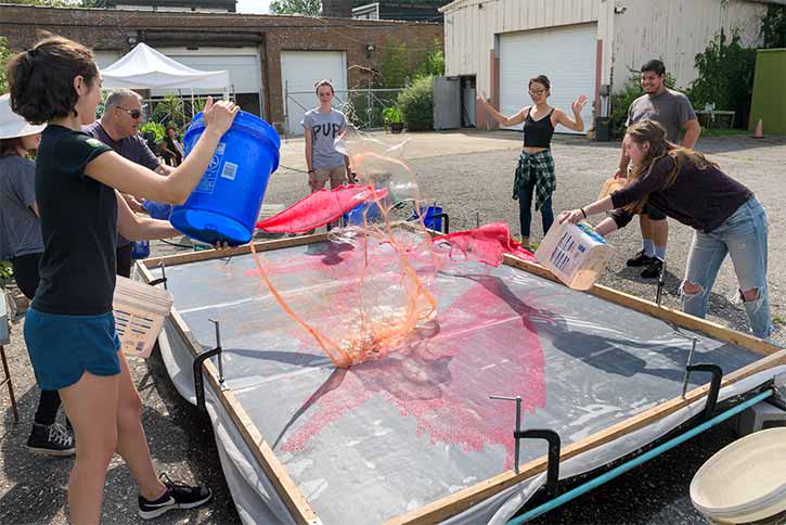 Resident artist Hong Hong teaches the Conservatory's Summer 2017 interns techniques used in creating her signature large-scale paper pours