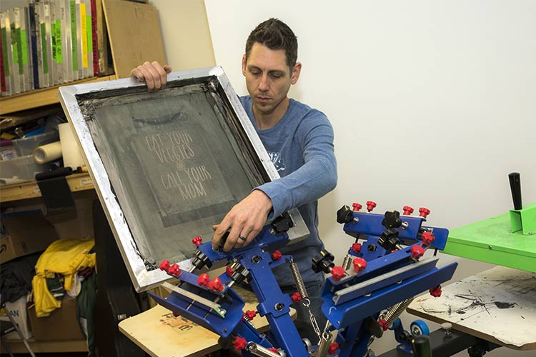 Doc Harrill preping for t-shirt screen printing