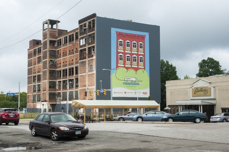The vacant, seven-story industrial building at 6611 Euclid Ave. across the street from Gallucci's and next to the Dunham Tavern on Euclid Avenue.