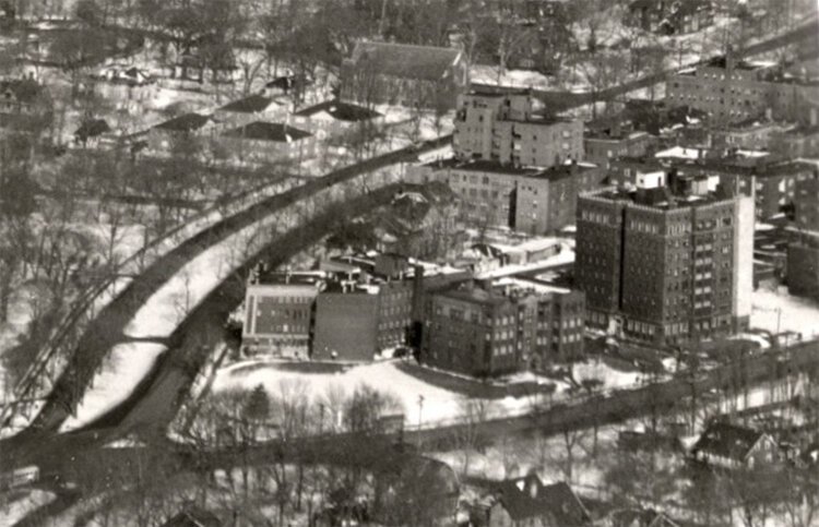 A photo from the 1950s shows the intersection of Cedar and Euclid Heights Boulevard from southwest of the site.