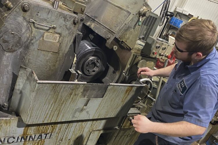 Max Hayes alum William Musselman operating an OD grinder (Outside Diameter grinder) at B & R Machine Co.