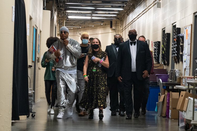 L L Cool J backstage heading for the press room with his entourage