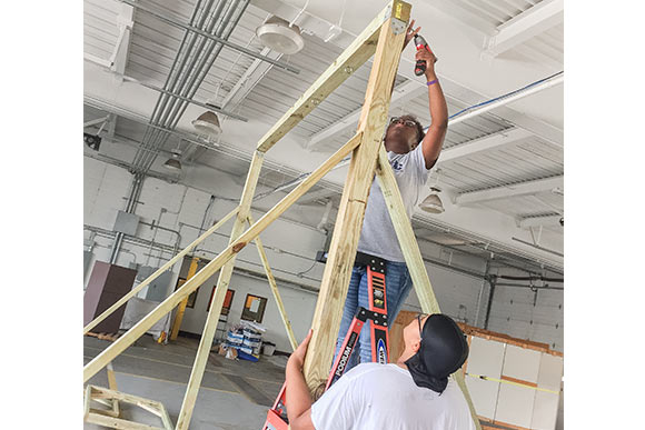 MOOS students working on the swing prototype