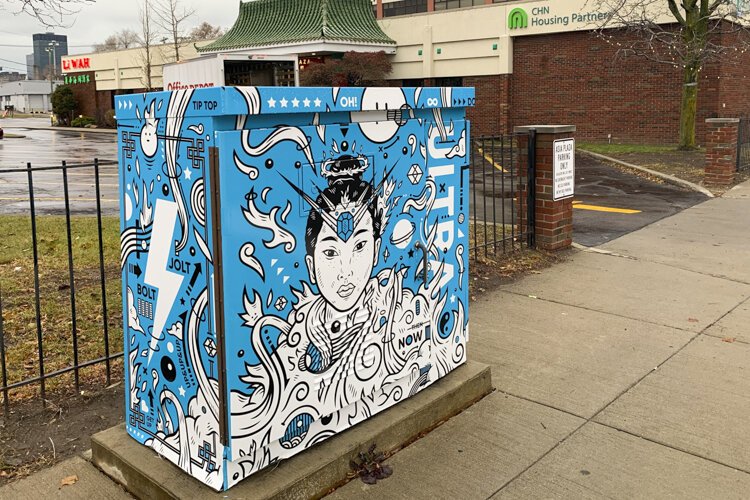 The utility box wrap at Payne Avenue and East 30th Street, titled “Sakuya-Hime” by Jordan Wong (WONGFACE).