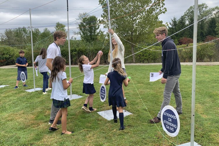 Gilmour Academy Lower School and Upper School students work together on an "inclusivemess canopy."