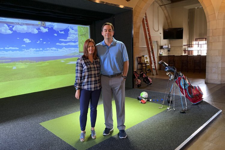 Meghan and Robert McMahon of Proximity Golf Lounge in the historic Heights Rockefeller Building.