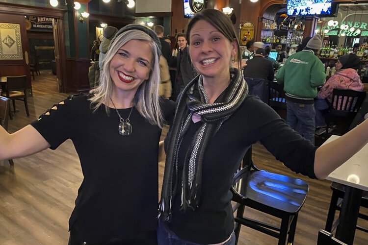 Artist Eileen Dorsey (left) with Stacey Lorenz, one of the original longtime Flannery's workers, whose husband still works there.