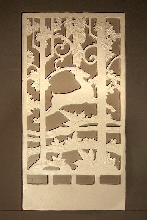 Art Deco wall plaque in the upper theater.